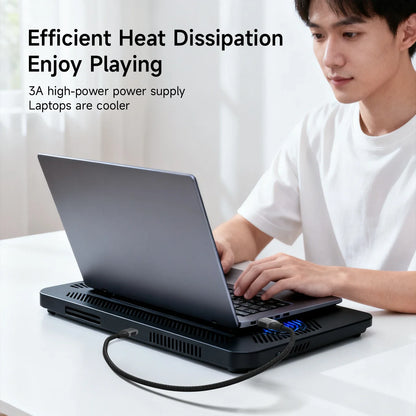 Person using a laptop with a cooling pad on a white surface, with text about heat dissipation.
