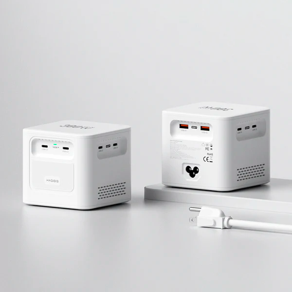 Two white power stations with a cable on a light gray background