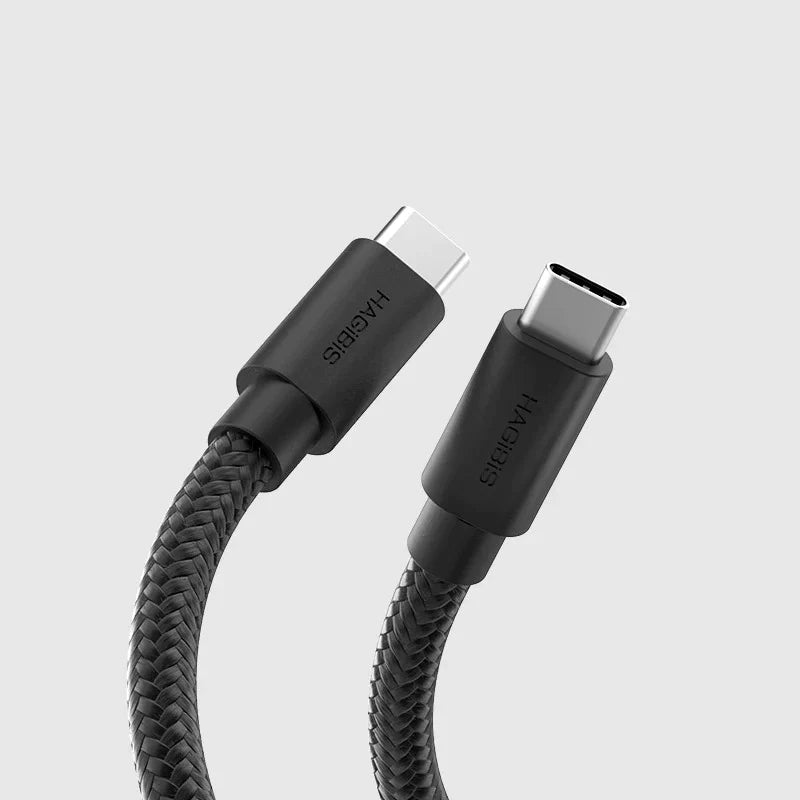 Black USB-C cable with braided design on a light gray background